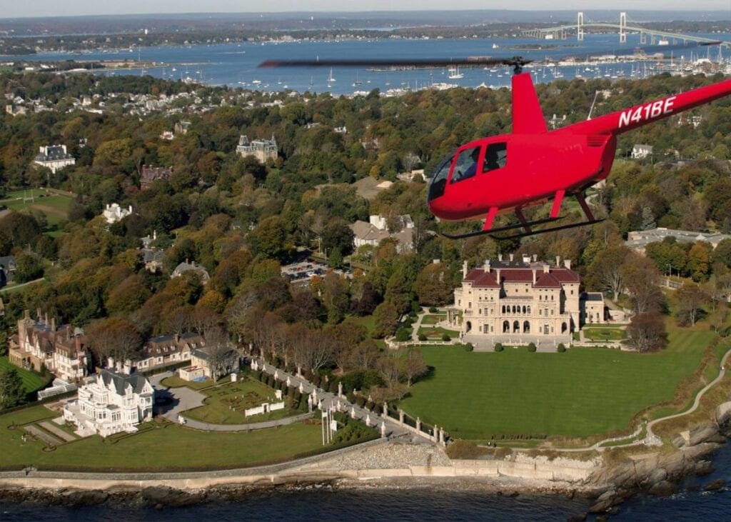 red helicopter flying over newport