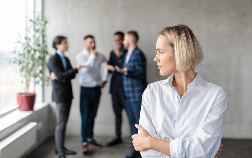 male coworkers whispering behind back of unhappy b 2021 08 30 00 05 01 utc