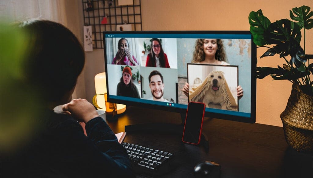 woman showing photo of dog on zoom