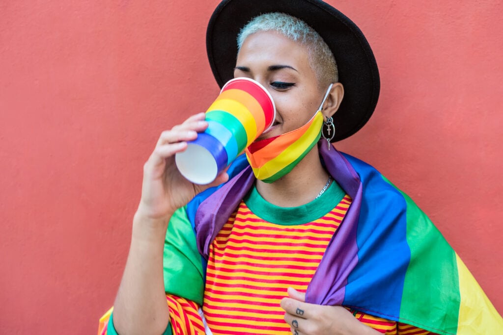 young woman drinking cocktail during gay pride par 2021 09 15 21 42 20 utc